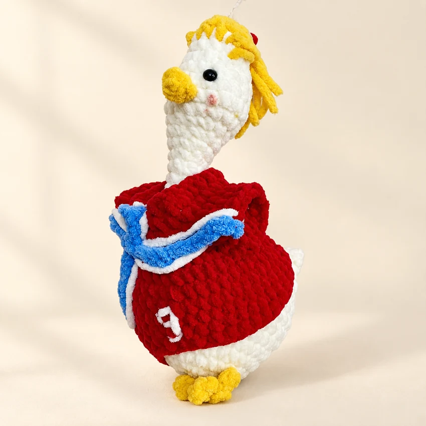 A white crochet goose wearing a red football jersey