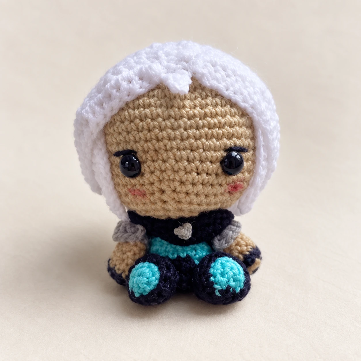 White-haired Jett crochet doll in a blue and black outfit